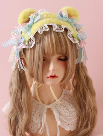 Yellow bear ear sweet lolita headband with plush ears white ruffled lace trim and pastel tri-color bow ribbons worn by lolita doll model
