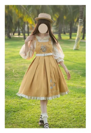 Yellow plus size elegant Lolita JSK dress with flying bird embroidery worn outdoors in tropical setting with matching coordinated inner blouse featuring lace-trimmed lantern sleeves