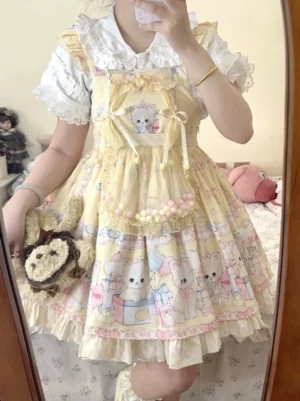 Yellow cat print lolita salopette dress with blouse mirror close-up front view peter pan collar pompom waist
