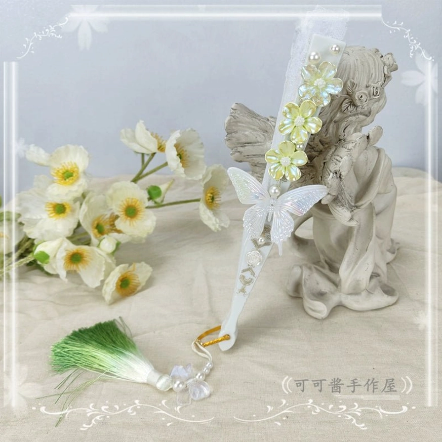 Yellow-green lolita folding fan side view with yellow-green flower decor white butterfly ornament and green gradient tassel bead pendant