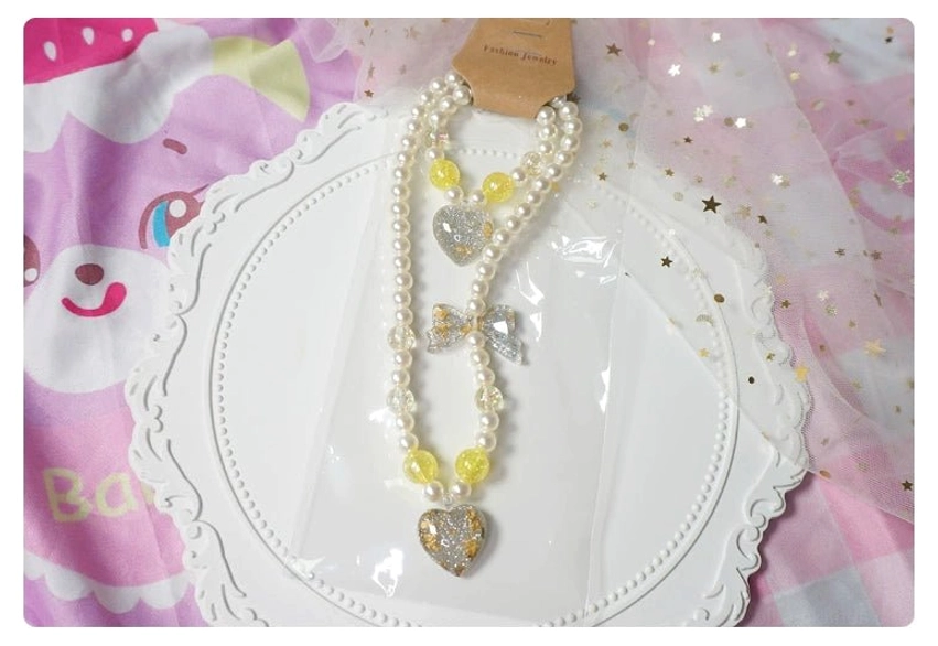 Yellow heart gradient pearl choker necklace and beaded bracelet kawaii lolita jewelry set flat lay
